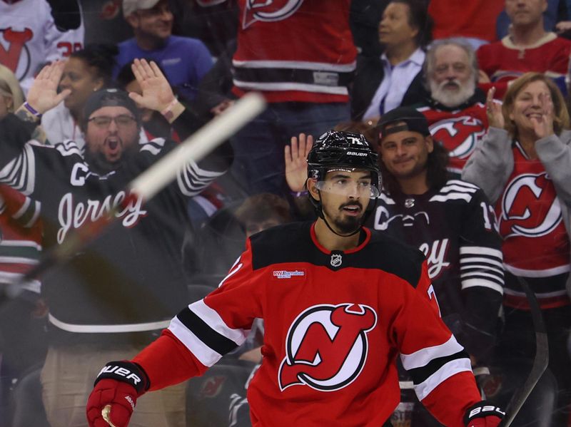 Nov 7, 2024; Newark, New Jersey, USA; New Jersey Devils defenseman Jonas Siegenthaler (71) celebrates his goal against the Montreal Canadiens during the second period at Prudential Center. Mandatory Credit: Ed Mulholland-Imagn Images