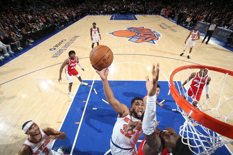 NEW YORK, NY - JANUARY 27: Karl-Anthony Towns #32 of the New York Knicks drives to the basket during the game against the Memphis Grizzlies on January 27, 2025 at Madison Square Garden in New York City, New York.  NOTE TO USER: User expressly acknowledges and agrees that, by downloading and or using this photograph, User is consenting to the terms and conditions of the Getty Images License Agreement. Mandatory Copyright Notice: Copyright 2025 NBAE  (Photo by Nathaniel S. Butler/NBAE via Getty Images)