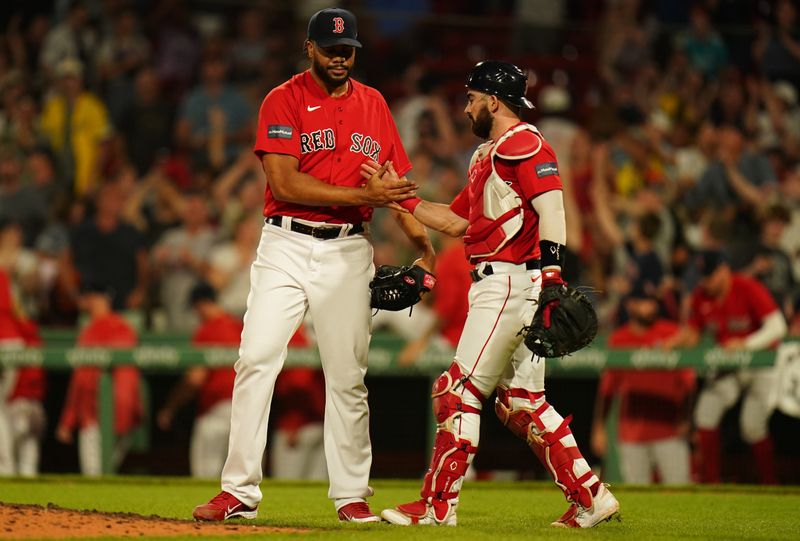 Jun 1, 2023; Boston, Massachusetts, USA; Boston Red Sox catcher Connor Wong (12) congratulates Boston Red Sox relief pitcher Kenley Jansen (74) in the ninth inning at Fenway Park. Mandatory Credit: David Butler II-USA TODAY Sports