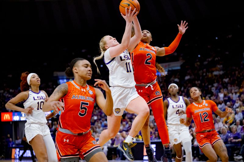 Feb 22, 2024; Baton Rouge, Louisiana, USA; LSU Lady Tigers guard Hailey Van Lith (11) drives to the basket against Auburn Tigers guard JaMya Mingo-Young (2) during the second half at Pete Maravich Assembly Center. Mandatory Credit: Matthew Hinton-USA TODAY Sports