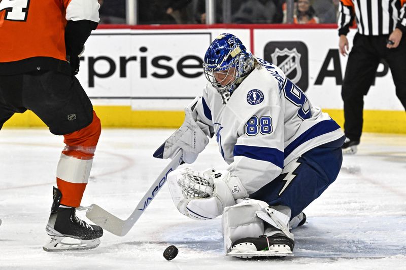 Jan 23, 2024; Philadelphia, Pennsylvania, USA; Tampa Bay Lightning goaltender Andrei Vasilevskiy (88) makes a save against the Philadelphia Flyers during the first period at Wells Fargo Center. Mandatory Credit: Eric Hartline-USA TODAY Sports