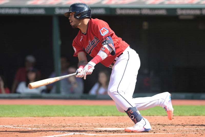 Sep 17, 2023; Cleveland, Ohio, USA; Cleveland Guardians shortstop Gabriel Arias (13) hits an RBI single during the fourth inning against the Texas Rangers at Progressive Field. Mandatory Credit: Ken Blaze-USA TODAY Sports