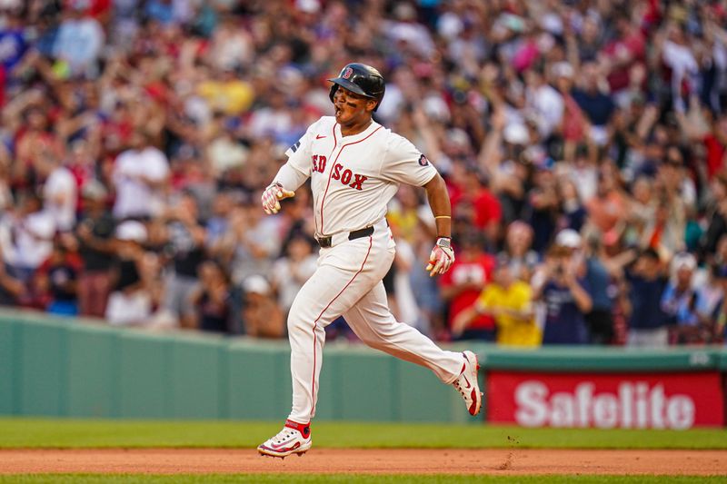 Jul 31, 2024; Boston, Massachusetts, USA; Boston Red Sox third baseman Rafael Devers (11) reacts after hitting a double to center field to drive in the winning run against the Seattle Mariners in the tenth inning at Fenway Park. Mandatory Credit: David Butler II-USA TODAY Sports