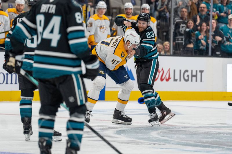 Jan 23, 2025; San Jose, California, USA;  San Jose Sharks right wing Barclay Goodrow (23) and Nashville Predators right wing Michael McCarron (47) fight during the first period at SAP Center at San Jose. Mandatory Credit: Neville E. Guard-Imagn Images