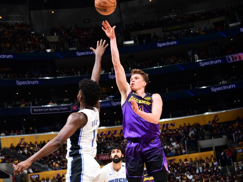 LOS ANGELES, CA - NOVEMBER 21: Dalton Knecht #4 of the Los Angeles Lakers shoots the ball during the game against the Orlando Magic on November 21, 2024 at Crypto.Com Arena in Los Angeles, California. NOTE TO USER: User expressly acknowledges and agrees that, by downloading and/or using this Photograph, user is consenting to the terms and conditions of the Getty Images License Agreement. Mandatory Copyright Notice: Copyright 2024 NBAE (Photo by Adam Pantozzi/NBAE via Getty Images)