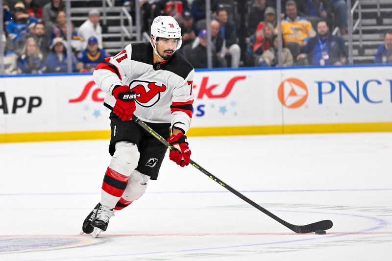 Nov 3, 2023; St. Louis, Missouri, USA;  New Jersey Devils defenseman Jonas Siegenthaler (71) controls the puck against the St. Louis Blues during the first period at Enterprise Center. Mandatory Credit: Jeff Curry-USA TODAY Sports