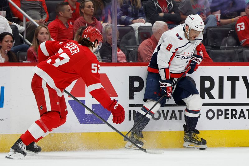 Apr 9, 2024; Detroit, Michigan, USA; Washington Capitals left wing Alex Ovechkin (8) skates with the puck defended by Detroit Red Wings defenseman Moritz Seider (53) in the third period at Little Caesars Arena. Mandatory Credit: Rick Osentoski-USA TODAY Sports