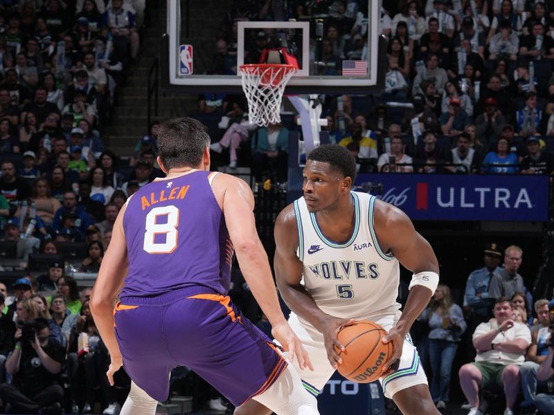 MINNEAPOLIS, MN -  APRIL 14: Anthony Edwards #5 of the Minnesota Timberwolves handles the ball during the game against the Phoenix Suns on April 14, 2024 at Target Center in Minneapolis, Minnesota. NOTE TO USER: User expressly acknowledges and agrees that, by downloading and or using this Photograph, user is consenting to the terms and conditions of the Getty Images License Agreement. Mandatory Copyright Notice: Copyright 2024 NBAE (Photo by Jordan Johnson/NBAE via Getty Images)