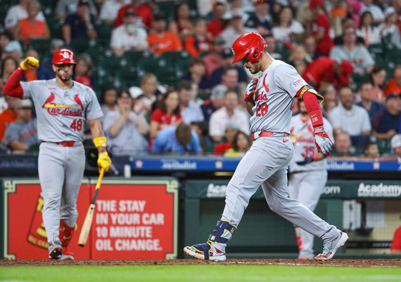 Jun 5, 2024; Houston, Texas, USA; St. Louis Cardinals third baseman Nolan Arenado (28) steps on home plate to score a run after hitting a home run during the sixth inning against the Houston Astros at Minute Maid Park. Mandatory Credit: Troy Taormina-USA TODAY Sports