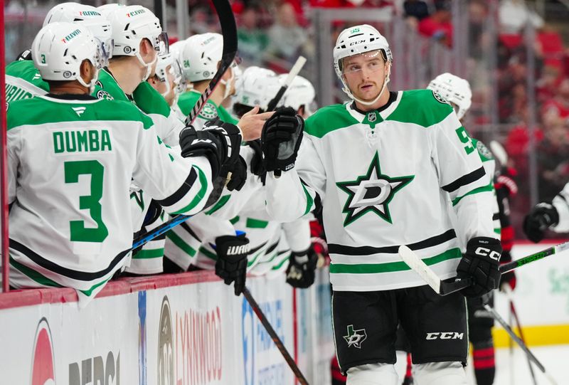 Nov 25, 2024; Raleigh, North Carolina, USA;  Dallas Stars defenseman Thomas Harley (55) celebrates his goal against the Carolina Hurricanes during the first period at Lenovo Center. Mandatory Credit: James Guillory-Imagn Images