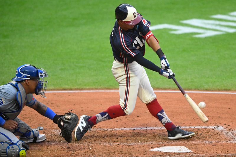 Jun 4, 2024; Cleveland, Ohio, USA; Cleveland Guardians center fielder Tyler Freeman (2) hits a two-run home run in the seventh inning against the Kansas City Royals at Progressive Field. Mandatory Credit: David Richard-USA TODAY Sports