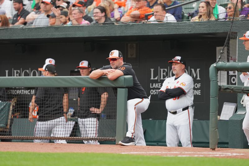 May 27, 2024; Baltimore, Maryland, USA; Baltimore Orioles manager Brandon Hyde (18) watches fourth inning action against the Boston Red Sox at Oriole Park at Camden Yards. Mandatory Credit: Mitch Stringer-USA TODAY Sports