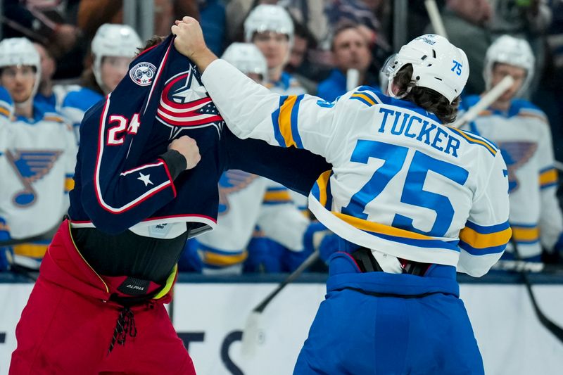 Nov 1, 2025; Columbus, Ohio, USA;  Columbus Blue Jackets right wing Mathieu Olivier (24) fights St. Louis Blues defenseman Tyler Tucker (75) in the first period at Nationwide Arena. Mandatory Credit: Aaron Doster-Imagn Images