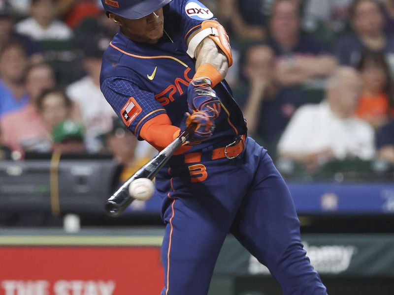 Sep 11, 2023; Houston, Texas, USA; Houston Astros shortstop Jeremy Pena (3) hits a single during the third inning against the Oakland Athletics at Minute Maid Park. Mandatory Credit: Troy Taormina-USA TODAY Sports