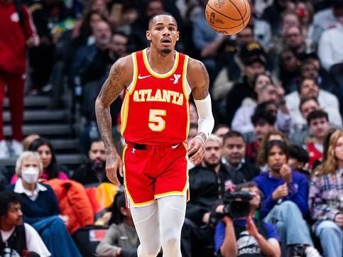 TORONTO, ON - DECEMBER 15: Dejounte Murray #5 of the Atlanta Hawks dribbles against the Toronto Raptors during the first half of their basketball game at the Scotiabank Arena on December 15, 2023 in Toronto, Ontario, Canada. NOTE TO USER: User expressly acknowledges and agrees that, by downloading and/or using this Photograph, user is consenting to the terms and conditions of the Getty Images License Agreement. (Photo by Mark Blinch/Getty Images)