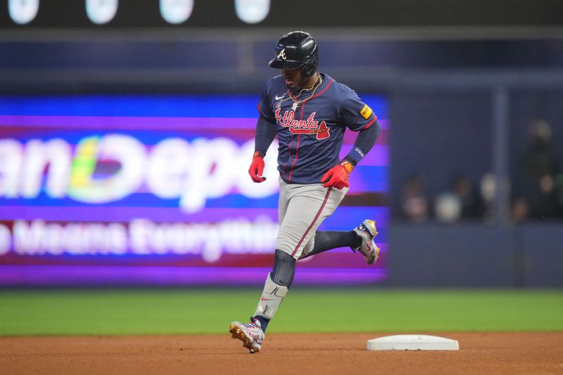 Sep 22, 2024; Miami, Florida, USA;  Atlanta Braves second baseman Ozzie Albies (1) rounds second base after hitting a home run against the Miami Marlins in the first inning at loanDepot Park. Mandatory Credit: Jim Rassol-Imagn Images