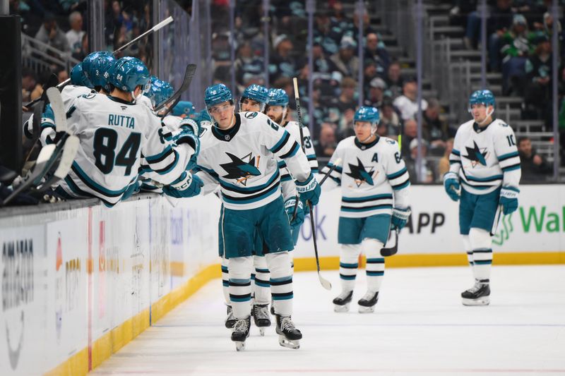 Nov 30, 2024; Seattle, Washington, USA; San Jose Sharks center Will Smith (2) celebrates with the bench after scoring a goal against the Seattle Kraken during the second period at Climate Pledge Arena. Mandatory Credit: Steven Bisig-Imagn Images