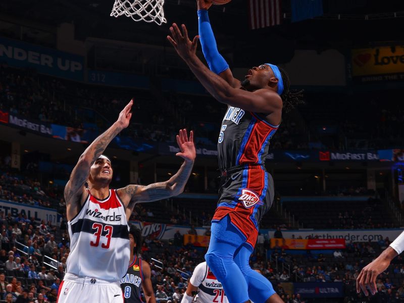 OKLAHOMA CITY, OK - JANUARY 6:  Luguentz Dort #5 of the Oklahoma City Thunder drives to the basket during the game against the  Washington Wizards on January 6, 2023 at Paycom Arena in Oklahoma City, Oklahoma. NOTE TO USER: User expressly acknowledges and agrees that, by downloading and or using this photograph, User is consenting to the terms and conditions of the Getty Images License Agreement. Mandatory Copyright Notice: Copyright 2023 NBAE (Photo by Zach Beeker/NBAE via Getty Images)