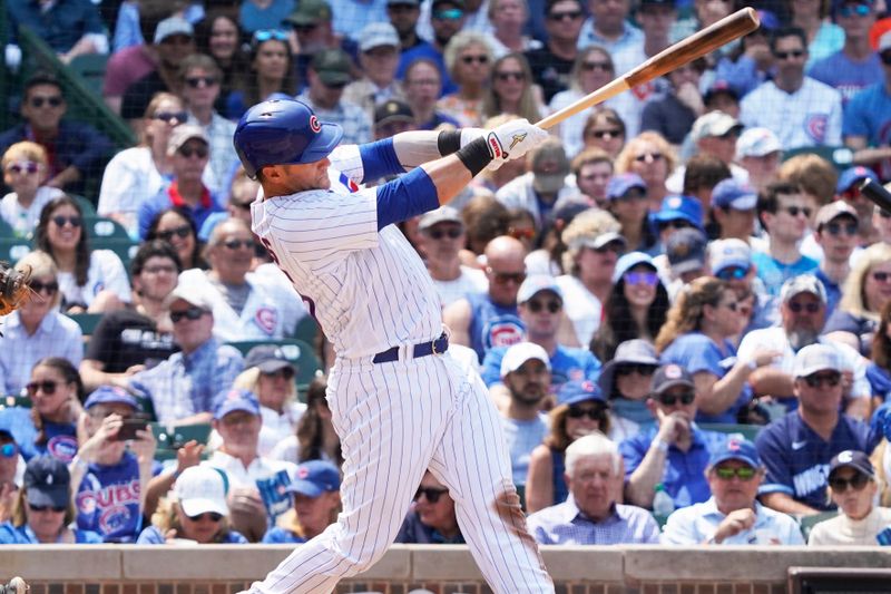 Jun 17, 2023; Chicago, Illinois, USA; Chicago Cubs catcher Yan Gomes (15) hits a double against the Baltimore Orioles during the fifth inning at Wrigley Field. Mandatory Credit: David Banks-USA TODAY Sports