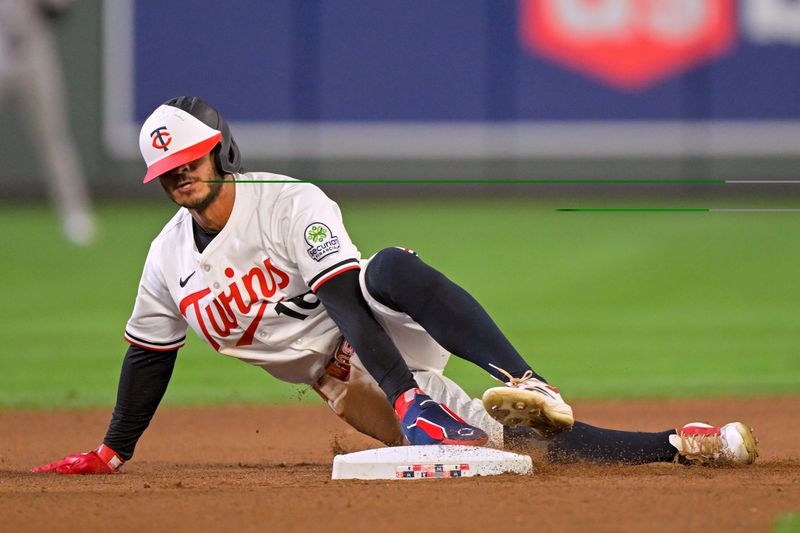 Sep 17, 2025; Minneapolis, Minnesota, USA;  Minnesota Twins outfielder Austin Martin (16) steals second against the New York Yankees during the seventh inning at Target Field. Mandatory Credit: Nick Wosika-Imagn Images