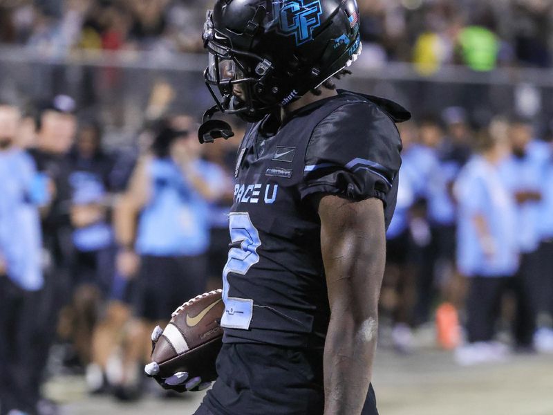 Oct 13, 2022; Orlando, Florida, USA; UCF Knights wide receiver Kobe Hudson (2) runs for a touchdown during the second half against the Temple Owls at FBC Mortgage Stadium. Mandatory Credit: Mike Watters-USA TODAY Sports