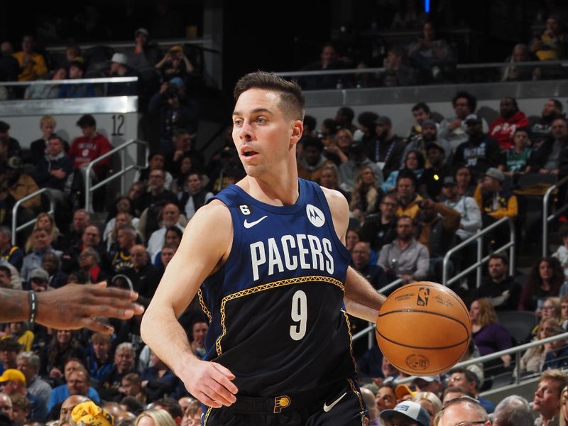 INDIANAPOLIS, IN - MARCH 27: T.J. McConnell #9 of the Indiana Pacers dribbles the ball during the game against the Dallas Mavericks on March 27, 2023 at Gainbridge Fieldhouse in Indianapolis, Indiana. NOTE TO USER: User expressly acknowledges and agrees that, by downloading and or using this Photograph, user is consenting to the terms and conditions of the Getty Images License Agreement. Mandatory Copyright Notice: Copyright 2023 NBAE (Photo by Ron Hoskins/NBAE via Getty Images)