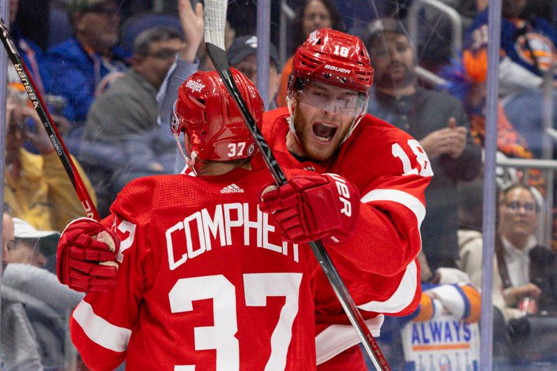 Oct 30, 2023; Elmont, New York, USA; Detroit Red Wings center Andrew Copp (18) celebrates the goal by teammate left wing J.T. Compher (37) against the New York Islanders during the third period at UBS Arena. Mandatory Credit: Thomas Salus-USA TODAY Sports