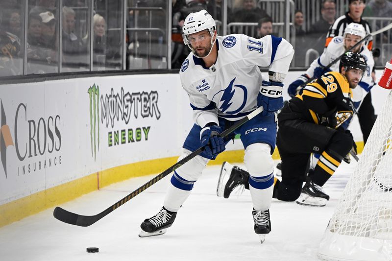 Mar 15, 2025; Boston, Massachusetts, USA; Tampa Bay Lightning center Luke Glendening (11) brings the puck out from behind the net during the second period against the Boston Bruins at TD Garden. Mandatory Credit: Eric Canha-Imagn Images