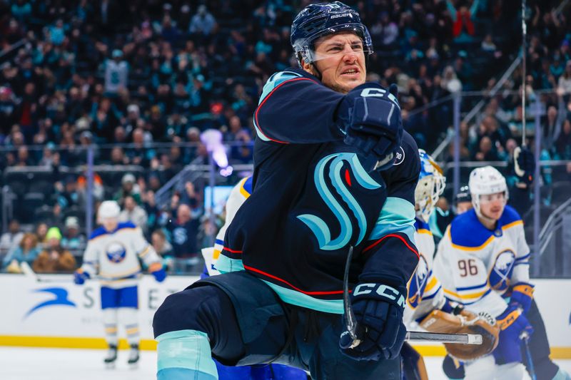 Jan 20, 2025; Seattle, Washington, USA; Seattle Kraken center John Hayden (15) celebrates after scoring a goal against the Buffalo Sabres during the first period at Climate Pledge Arena. Mandatory Credit: Joe Nicholson-Imagn Images