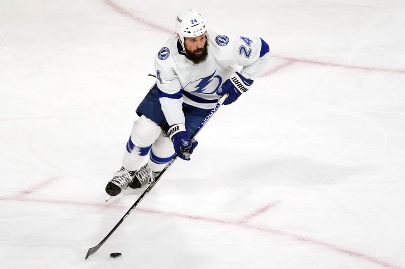 Feb 15, 2023; Tempe, Arizona, USA; Tampa Bay Lightning defenseman Zach Bogosian (24) skates the puck against the Arizona Coyotes during the second period at Mullett Arena. Mandatory Credit: Joe Camporeale-USA TODAY Sports