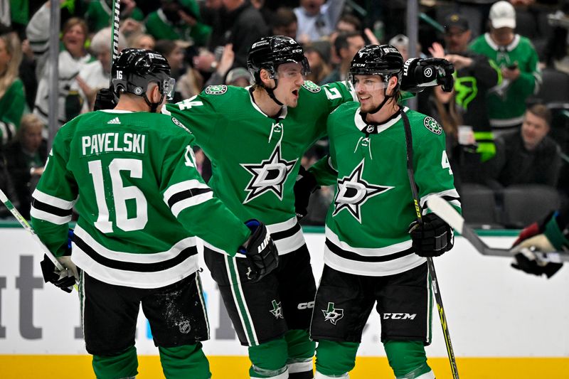 Nov 14, 2023; Dallas, Texas, USA; Dallas Stars center Joe Pavelski (16) and center Roope Hintz (24) and defenseman Miro Heiskanen (4) celebrates a power play goal scored by Hintz against the Arizona Coyotes during the second period at the American Airlines Center. Mandatory Credit: Jerome Miron-USA TODAY Sports