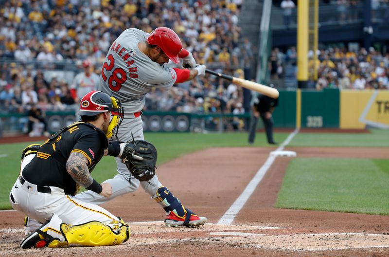 Jul 23, 2024; Pittsburgh, Pennsylvania, USA;  St. Louis Cardinals third baseman Nolan Arenado (28) hits a solo home run against the Pittsburgh Pirates during the fifth inning at PNC Park. Mandatory Credit: Charles LeClaire-USA TODAY Sports