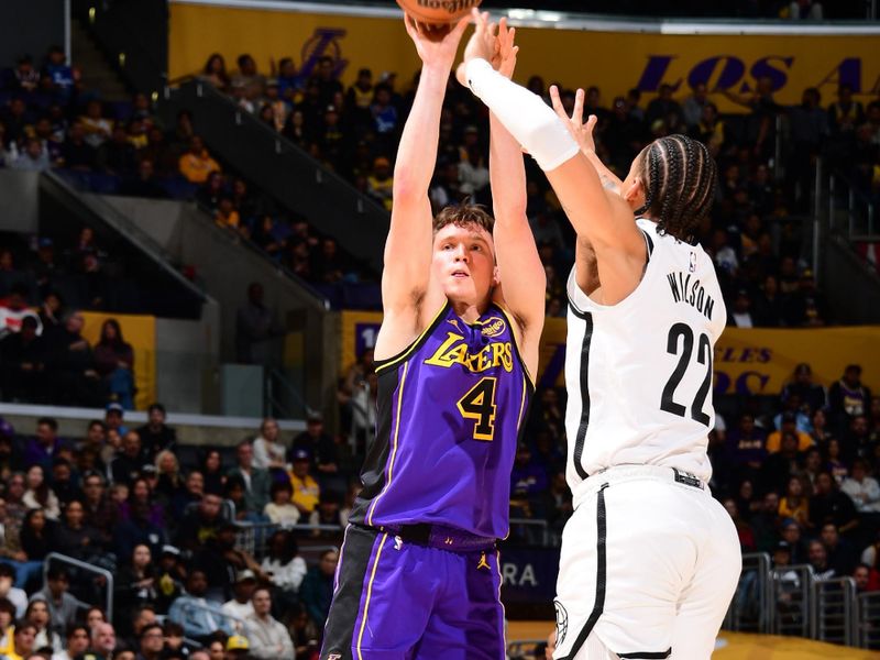 LOS ANGELES, CA - JANUARY 17: Dalton Knecht #4 of the Los Angeles Lakers shoots the ball during the game against the Brooklyn Nets on January 17, 2025 at Crypto.Com Arena in Los Angeles, California. NOTE TO USER: User expressly acknowledges and agrees that, by downloading and/or using this Photograph, user is consenting to the terms and conditions of the Getty Images License Agreement. Mandatory Copyright Notice: Copyright 2025 NBAE (Photo by Adam Pantozzi/NBAE via Getty Images)