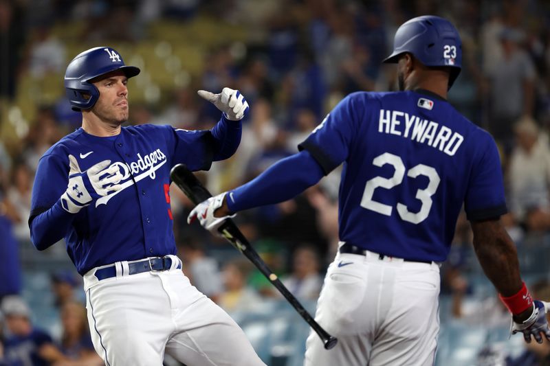 Aug 3, 2023; Los Angeles, California, USA;  Los Angeles Dodgers first baseman Freddie Freeman (5) celebrates with right fielder Jason Heyward (23) after hitting a home run during the eighth inning against the Oakland Athletics at Dodger Stadium. Mandatory Credit: Kiyoshi Mio-USA TODAY Sports