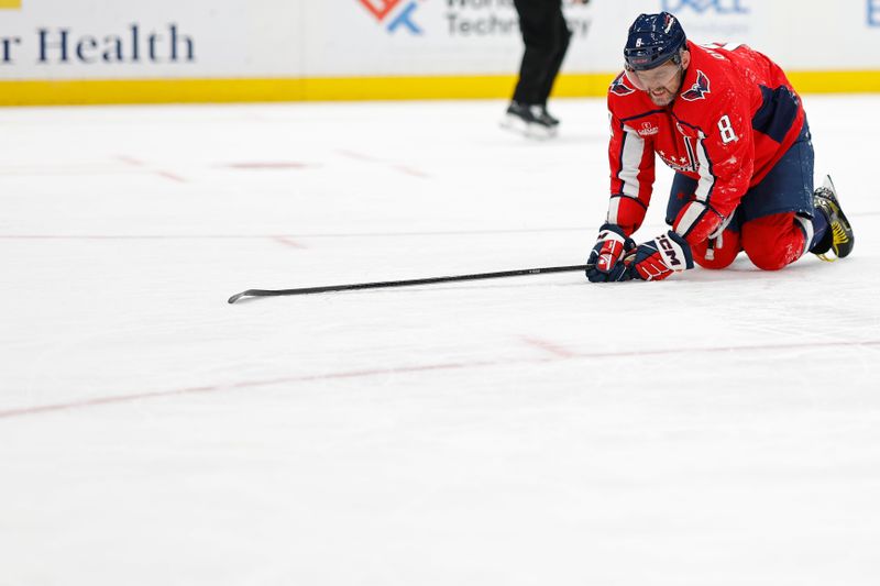 Jan 5, 2024; Washington, District of Columbia, USA; Washington Capitals left wing Alex Ovechkin (8) kneels on the ice after being injure against the Carolina Hurricanes in the third period at Capital One Arena. Mandatory Credit: Geoff Burke-USA TODAY Sports