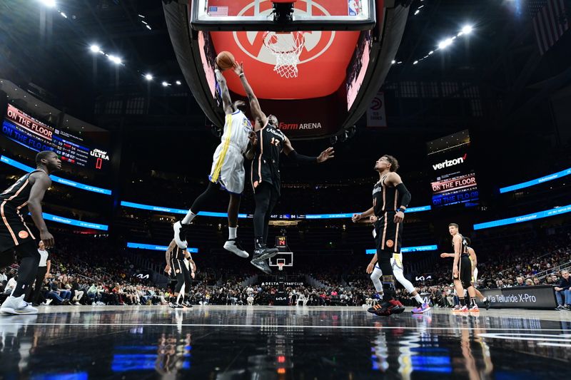 ATLANTA, GA - MARCH 17: JaMychal Green #1 of the Golden State Warriors drives to the basket during the game against the Atlanta Hawks on March 17, 2023 at State Farm Arena in Atlanta, Georgia.  NOTE TO USER: User expressly acknowledges and agrees that, by downloading and/or using this Photograph, user is consenting to the terms and conditions of the Getty Images License Agreement. Mandatory Copyright Notice: Copyright 2023 NBAE (Photo by Adam Hagy/NBAE via Getty Images)