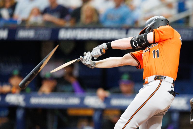 Jun 8, 2024; St. Petersburg, Florida, USA;  Baltimore Orioles third baseman Jordan Westburg (11) breaks his bat on a fly ball against the Tampa Bay Rays in the sixth inning at Tropicana Field. Mandatory Credit: Nathan Ray Seebeck-USA TODAY Sports