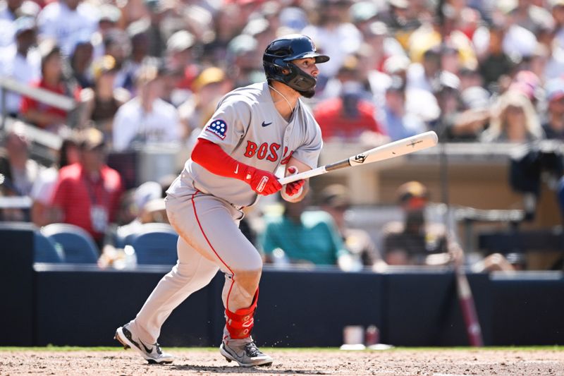 Aug 10, 2025; San Diego, California, USA; Boston Red Sox right fielder Wilmer Abreu (52) hits a single during the seventh inning against the San Diego Padres at Petco Park. Mandatory Credit: Denis Poroy-Imagn Images
