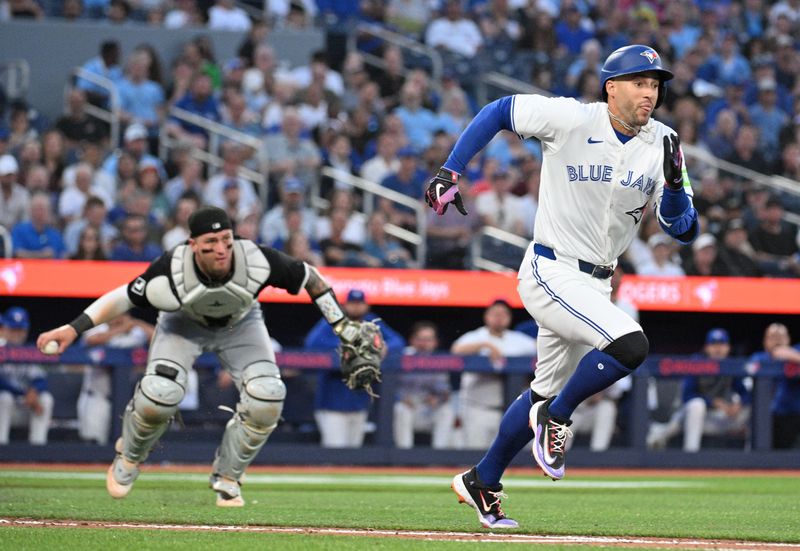 May 21, 2024; Toronto, Ontario, CAN;   Chicago White Sox catcher Korey Lee (26) fields a ground ball hit by Toronto Blue Jays right fielder George Springer in the fifth inning at Rogers Centre. Mandatory Credit: Dan Hamilton-USA TODAY Sports