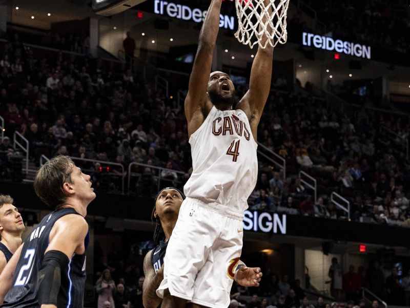 CLEVELAND, OHIO - FEBRUARY 22: Evan Mobley #4 of the Cleveland Cavaliers dunks the ball during the game against the against the Orlando Magic at Rocket Mortgage Fieldhouse on February 22, 2024 in Cleveland, Ohio. The Magic beat the Cavaliers 116-109.<p><br/></p>NOTE TO USER: User expressly acknowledges and agrees that, by downloading and or using this photograph, User is consenting to the terms and conditions of the Getty Images License Agreement. (Photo by Lauren Leigh Bacho/Getty Images)