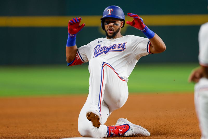 May 15, 2024; Arlington, Texas, USA; Texas Rangers outfielder Leody Taveras (3) hits a triple during the fifth inning against the Cleveland Guardians at Globe Life Field. Mandatory Credit: Andrew Dieb-USA TODAY Sports