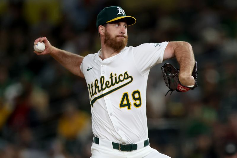 Jun 7, 2025; West Sacramento, California, USA; Athletics pitcher Michael Kelly (49) throws a pitch against the Baltimore Orioles during the ninth inning at Sutter Health Park. Mandatory Credit: Dennis Lee-Imagn Images