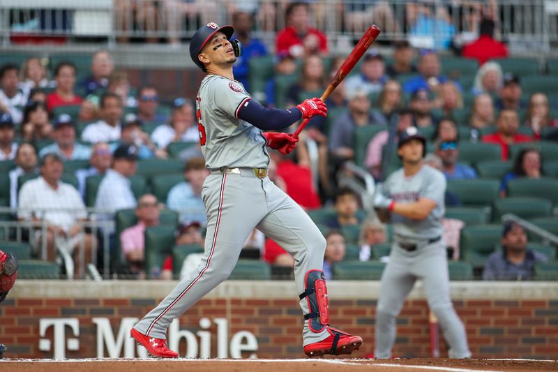 May 28, 2024; Atlanta, Georgia, USA; Washington Nationals first baseman Joey Meneses (45) hits a single against the Atlanta Braves in the first inning at Truist Park. Mandatory Credit: Brett Davis-USA TODAY Sports