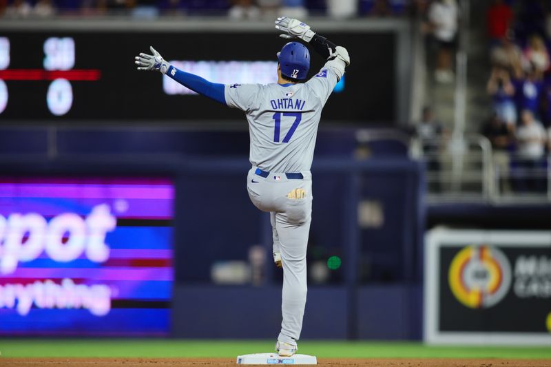 Sep 19, 2024; Miami, Florida, USA; Los Angeles Dodgers designated hitter Shohei Ohtani (17) reacts from second base after hitting a double against the Miami Marlins during the first inning at loanDepot Park. Mandatory Credit: Sam Navarro-Imagn Images