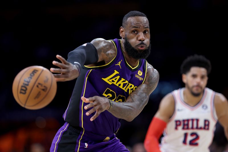 LOS ANGELES, CALIFORNIA - MARCH 22: LeBron James #23 of the Los Angeles Lakers passes the ball during the second half of a game against the Philadelphia 76ers at Crypto.com Arena on March 22, 2024 in Los Angeles, California. NOTE TO USER: User expressly acknowledges and agrees that, by downloading and/or using this photograph, user is consenting to the terms and conditions of the Getty Images License Agreement. (Photo by Sean M. Haffey/Getty Images)