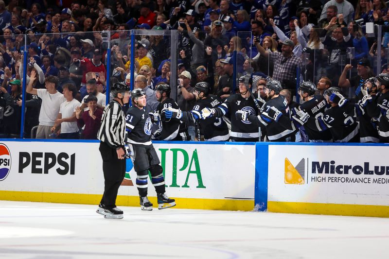 Mar 14, 2026; Tampa, Florida, USA; Tampa Bay Lightning defenseman Charle-Edouard D'Astous (51) celebrates a goal with the bench against the Carolina Hurricanes in the second period at Benchmark International Arena. Mandatory Credit: Morgan Tencza-Imagn Images Mar 14, 2026; Tampa, Florida, USA; Tampa Bay Lightning defenseman Charle-Edouard D'Astous (51) celebrates a goal with the bench against the Carolina Hurricanes in the second period at Benchmark International Arena. Mandatory Credit: Morgan Tencza-Imagn Images