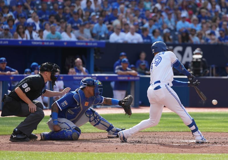 Sep 10, 2023; Toronto, Ontario, CAN; Toronto Blue Jays center fielder Kevin Kiermaier (39) reaches first base on fielders choice against the Kansas City Royals during the eighth inning at Rogers Centre. Mandatory Credit: Nick Turchiaro-USA TODAY Sports