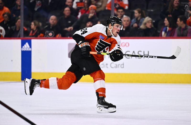 Dec 14, 2023; Philadelphia, Pennsylvania, USA; Philadelphia Flyers defenseman Nick Seeler (24) shoots against the Washington Capitals in the third period at Wells Fargo Center. Mandatory Credit: Kyle Ross-USA TODAY Sports