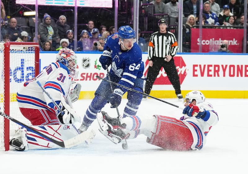 Dec 19, 2023; Toronto, Ontario, CAN; Toronto Maple Leafs center David Kampf (64) battles in front of New York Rangers goaltender Igor Shesterkin (31) during the first period at Scotiabank Arena. Mandatory Credit: Nick Turchiaro-USA TODAY Sports