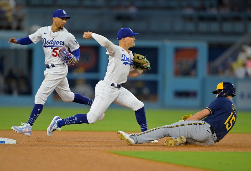 Aug 17, 2023; Los Angeles, California, USA;  Milwaukee Brewers right fielder Tyrone Taylor (15) is out on a double play as Los Angeles Dodgers shortstop Enrique Hernandez (8) throws to first after right fielder Mookie Betts (50) fielded the ball in the third inning at Dodger Stadium. Mandatory Credit: Jayne Kamin-Oncea-USA TODAY Sports